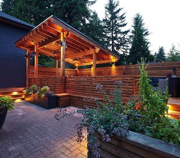A western red cedar deck with a patio cover pergola and garden planters