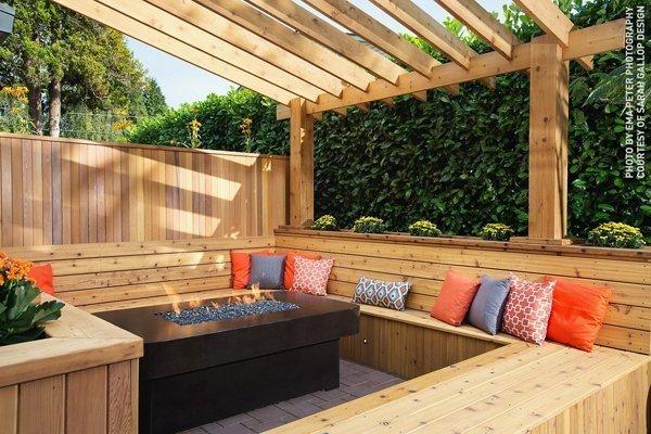 A western red cedar bench surrounding a fire pit
